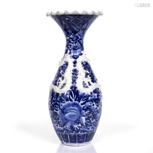 Blue & white vase Japanese, 19th/20th Century decorated with a raised swirling dragon, in blue and