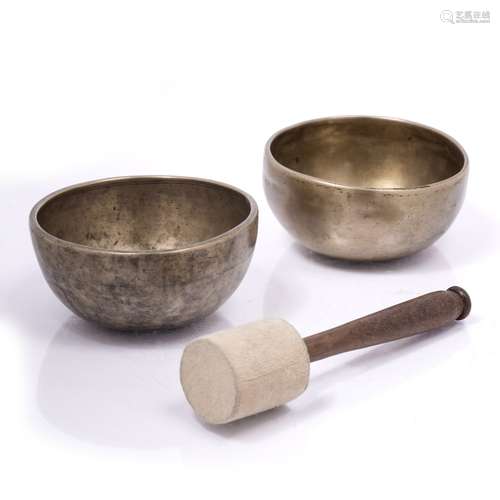 Two Tibetan singing bowls Tibetan made of alloyed bronze 11cm across (2)