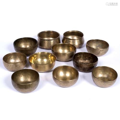 Nine singing bowls Tibetan/Nepalese Bronze alloy largest 12cm across together with two further