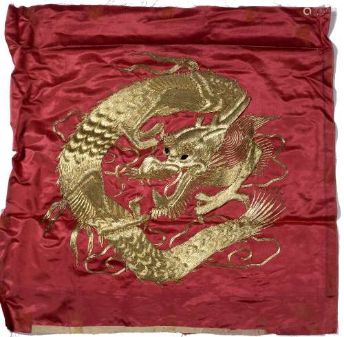 Red silk panel Chinese, circa 1900 with gold metal thread, design of dragon 49cm across x 53cm