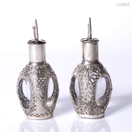 Pair of white metal scent bottles Chinese, circa 1900 of triform with dragon mounts 13cm