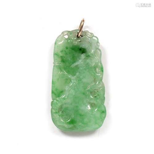 Jade pendant Chinese,19th/early 20th Century simply carved with a bird and trailing foliage, with