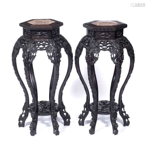Pair of marble top urn stands Chinese, late 19th Century each with inset rose-marble carved border