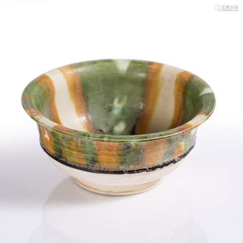 Sancai bowl Chinese, Tang Dynasty with a waisted body and everted rim, the interior with petal style