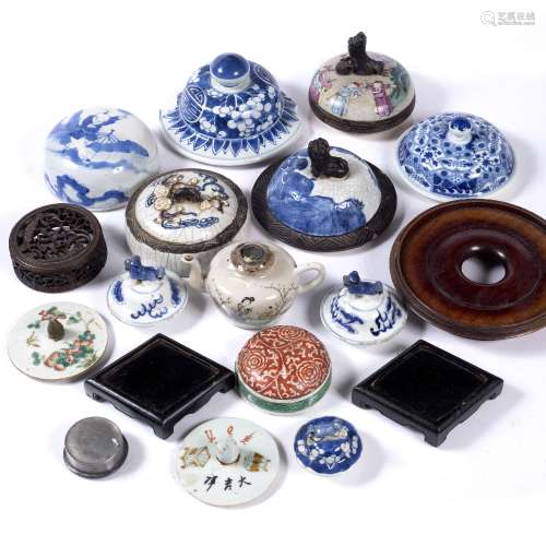 Assorted collection of lids and stands Chinese to include various wooden stands, blue and white lids