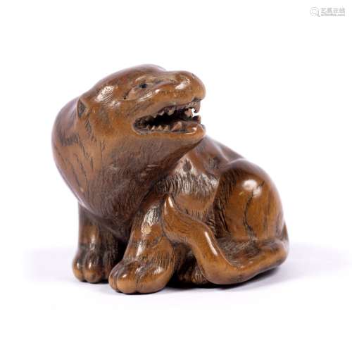 Wood Netsuke in the form of a tiger Japanese, Kyoto school the seated tiger open mouthed glancing