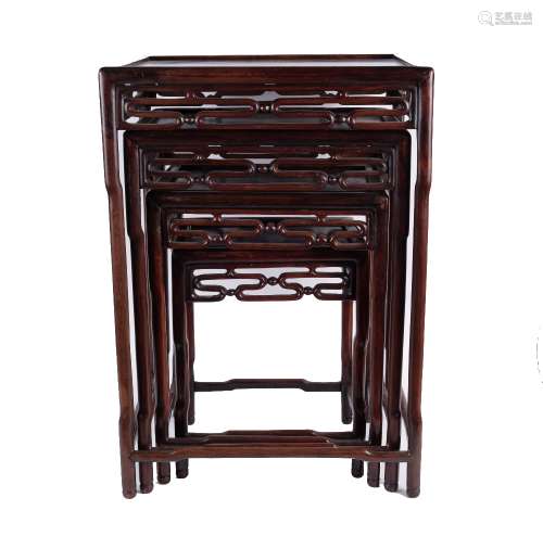 Nest of hardwood tables Chinese, 19th Century each with a carved border largest 51cm x 36cm
