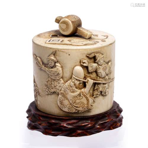 Ivory tusk box and cover Japanese, late Meiji carved in relief with Hotei and Fukurokoja kubihiki