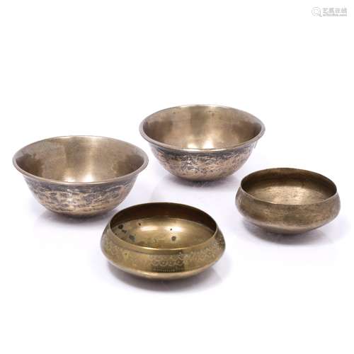 Four water sounding bowls Tibetan from the Himalayan area largest 14.5cm across (4)