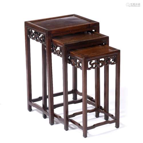 Nest of three hardwood tables Chinese, 19th Century each with rectangular top and carved frieze