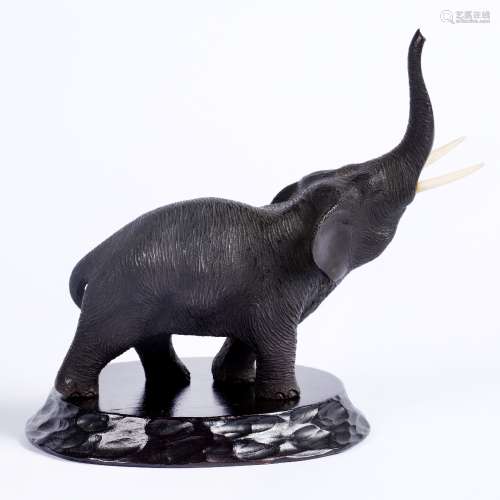 Bronze model of a standing trumpeting elephant Japanese, Meiji Period ivory tusks, signed Seikoku,
