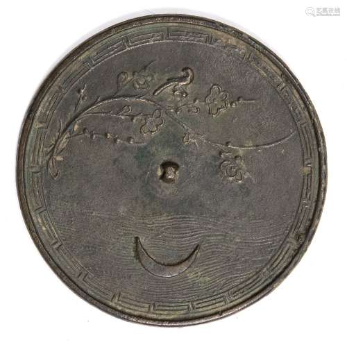 Hand mirror Japanese, 18th century decorated in relief to one side depicting a crescent moon and a