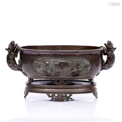 Bronze oval jardiniere on stand Chinese, 19th Century with reserved oval panel with tortoise,