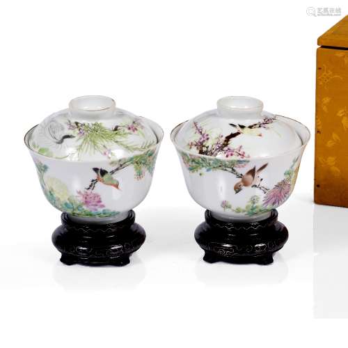 Pair of famille rose cups and covers late 19th Century painted with a bird on a branch and