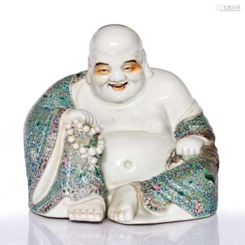 Porcelain Putai Chinese, early 20th Century the smiling seated figure holding a string of beads,