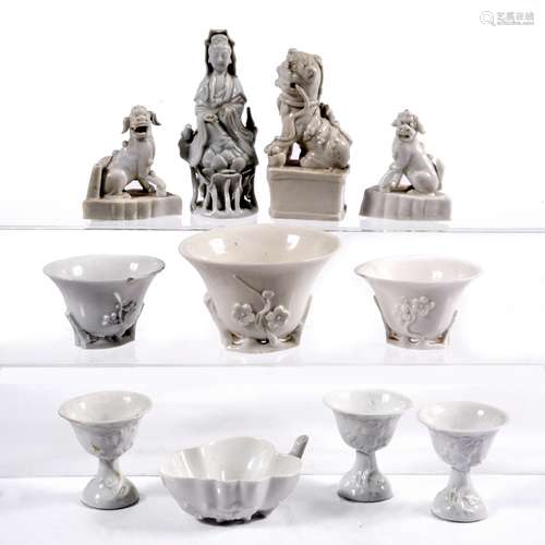 Group of blanc de chine Chinese to include three models of dog of fo, three libation cups, three