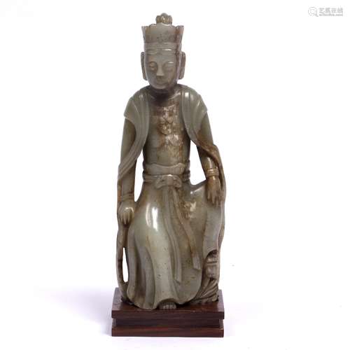 Pale green jade figure of a seated Bodhisattva Chinese, 17th Century in flowering robes and