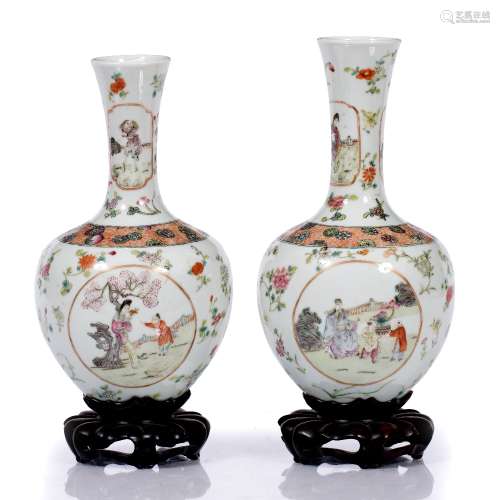 Pair of vases on stands Chinese, late 19th Century of white ground, painted with various garden