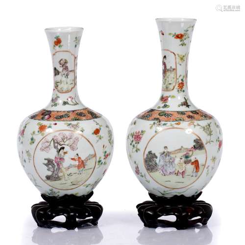 Pair of vases on stands Chinese, late 19th Century of white ground, painted with various garden