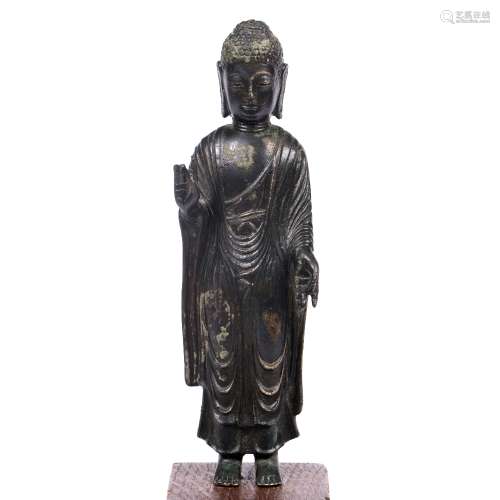 Standing bronze Buddha Japanese, Kamakura period modelled with traditional robes, on a wooden base