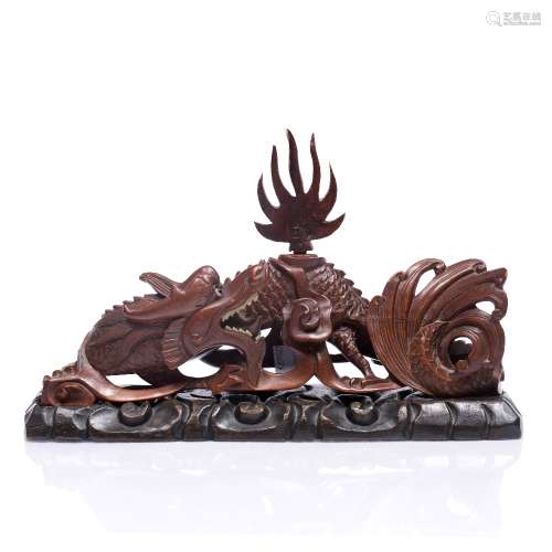 Model of a dragon Chinese,early 20th Century in a recumbent pose, with a flame finial, on a later
