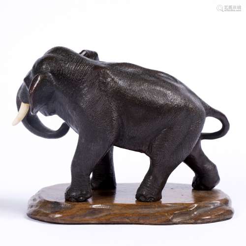 Bronze model of a standing elephant with curled trunk Japanese, Meiji Period ivory tusks, signed
