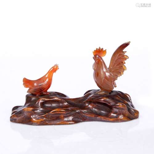 Cockerel and chicken Chinese, circa 1900 the hard stone birds on a wooden base 13cm overall