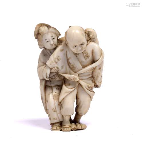 Ivory netsuke carved as a standing Geisha Japanese, late Meiji standing behind and assisting an