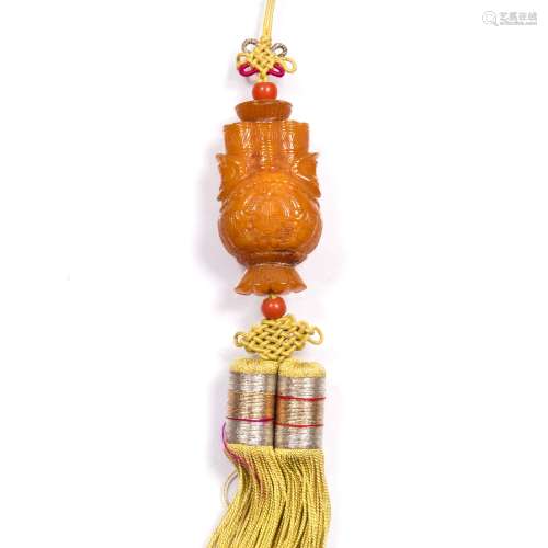 Carved amber pendant Chinese in the form of archaic vase with long life symbol having a yellow
