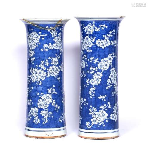 Pair of trumpet vases Chinese, 19th Century with prunus decoration on a blue ground, Kangxi four