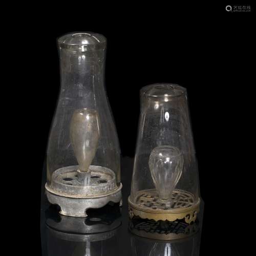 Two opium lamps Chinese, 19th/20th century the first with a Metal base, glass oil holder. Height