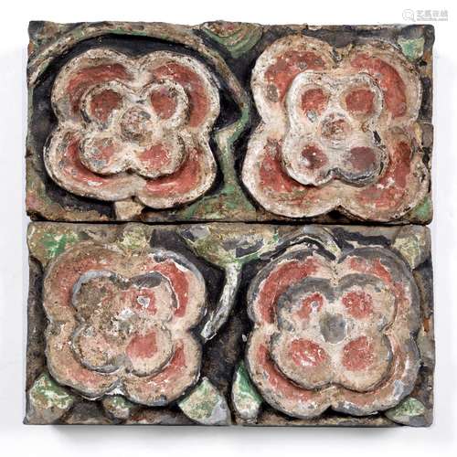 Pair of wall tiles Chinese, Jin (1115-1234) decorated as rosettes, with the remains of red paint 5cm