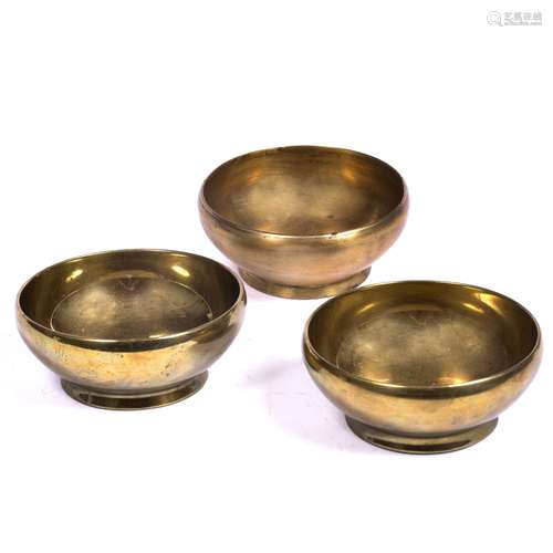 Three ' Panic bowls ' Nepalese, 18th to 20th century Bronze alloy 12.5cm across (3)