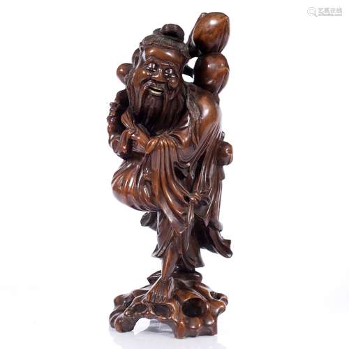 Carved wood model of Shou Lou Chinese, circa 1900 the figure carrying fruit on his back 39cm