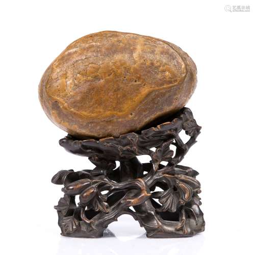 Scholars rock Chinese, 18th century finely smoothed of honey coloured 'Yellow wax' stone, on a