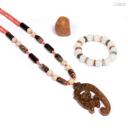 Jade and coral necklace Chinese a carved yellow jade pebble and a bracelet with coloured hardstones.