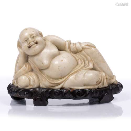 Model of a recumbent soapstone Putai Chinese, 18th/19th Century the smiling figure resting with