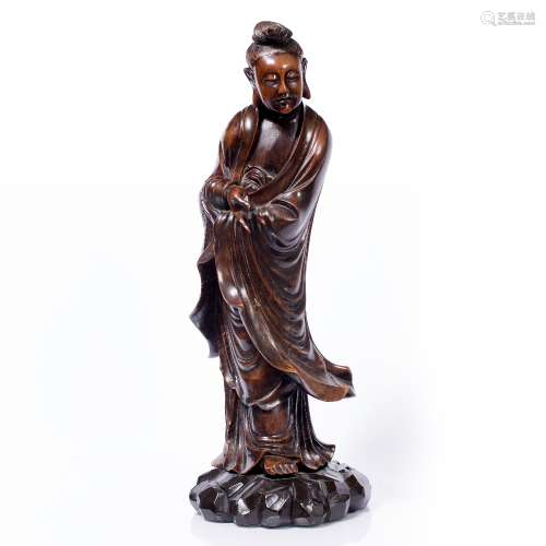 Carved wood model of Guanyin Chinese, 18th/19th Century the standing figure with one hand resting
