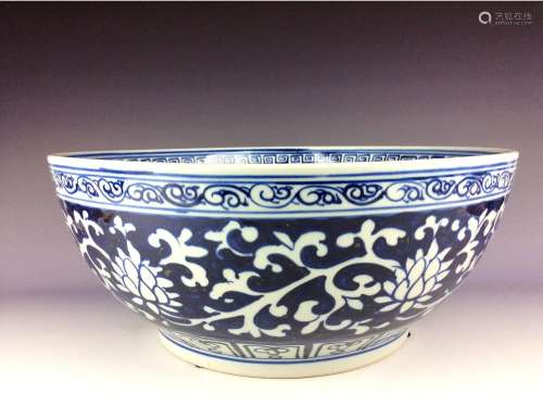 Chinese B/W celadon bowl painted with floral interlocking branch pattern.