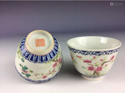 A pair of Chinese famillie rose cups with floral motif