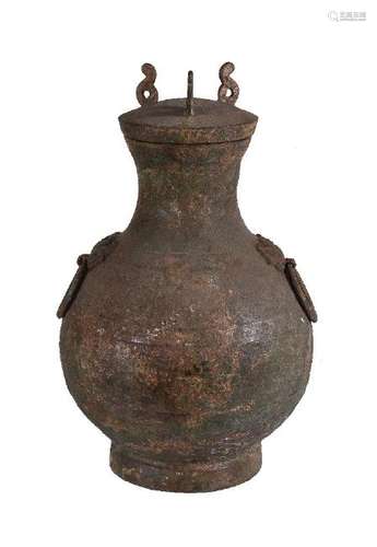 A Chinese archaic bronze storage vessel and cover