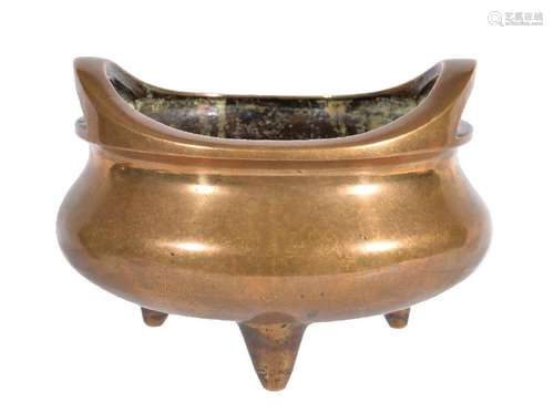 A Chinese  bronze twin-handled tripod censer