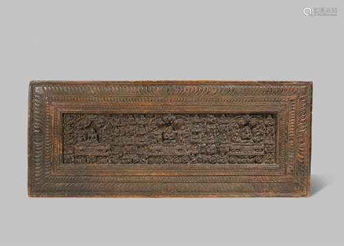 A RARE TIBETAN CARVED WOOD BOOK COVER