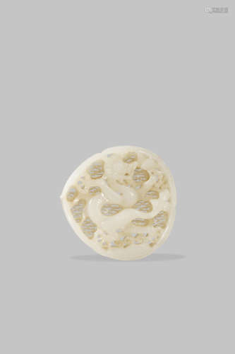 A CHINESE PALE CELADON JADE RETICULATED 'DRAGON' PLAQUE