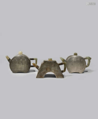 THREE CHINESE INSCRIBED PEWTER-ENCASED YIXING TEAPOTS AND COVERS