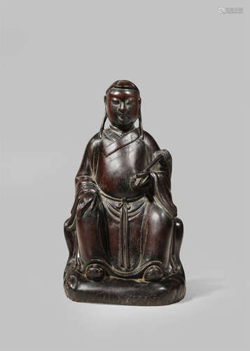 A CHINESE ZITAN FIGURE OF A SCHOLAR