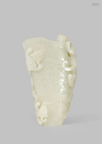 A CHINESE PALE CELADON JADE ARCHAISTIC 'CHILONG' RHYTON