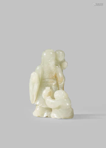 A CHINESE PALE CELADON JADE CARVING OF SHOULAO AND ATTENDANTS