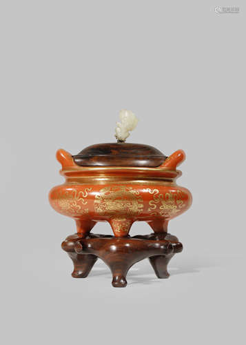 A CHINESE CORAL-RED AND GILT TRIPOD INCENSE BURNER AND COVER