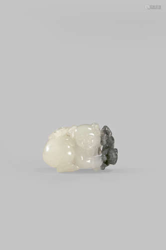 A CHINESE BLACK AND WHITE JADE CARVING OF A BOY AND A CAT